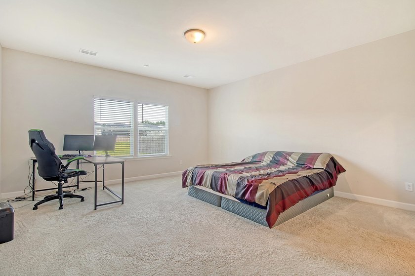 Proudly presenting this exceptional 4-bedroom, 2.5-bathroom home - photo 17