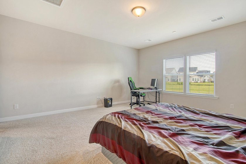 Proudly presenting this exceptional 4-bedroom, 2.5-bathroom home - photo 19