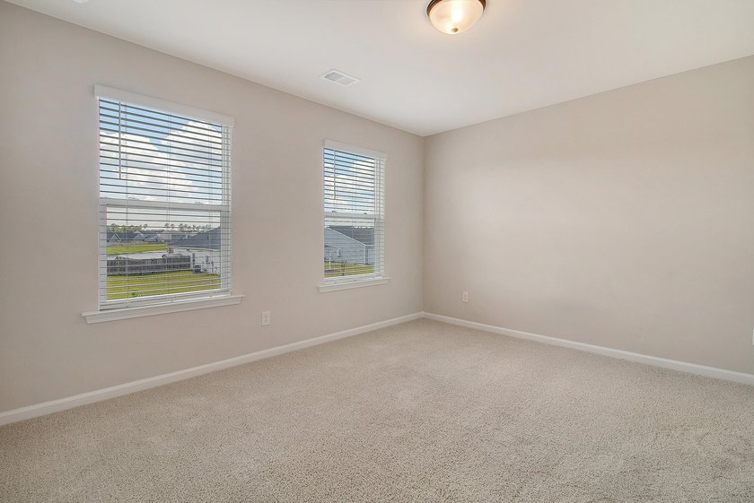 Proudly presenting this exceptional 4-bedroom, 2.5-bathroom home - photo 30