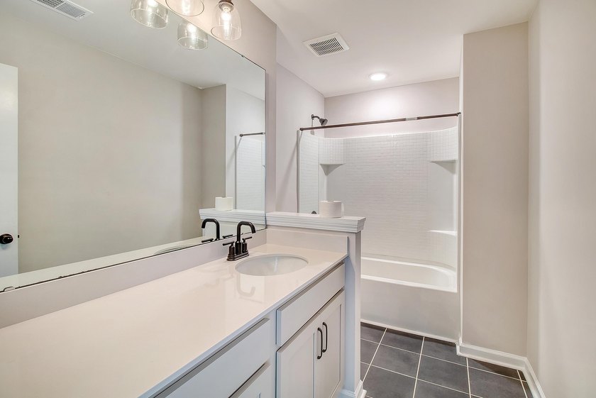 Proudly presenting this exceptional 4-bedroom, 2.5-bathroom home - photo 32