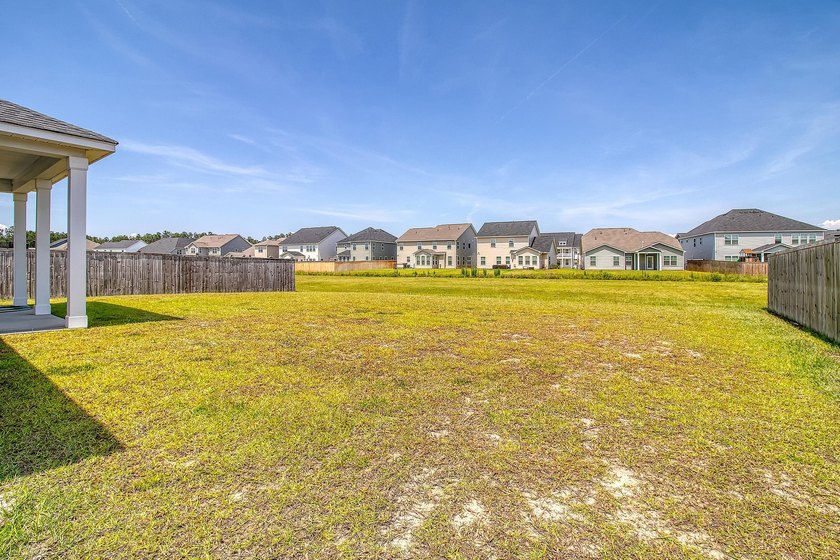 Proudly presenting this exceptional 4-bedroom, 2.5-bathroom home - photo 35