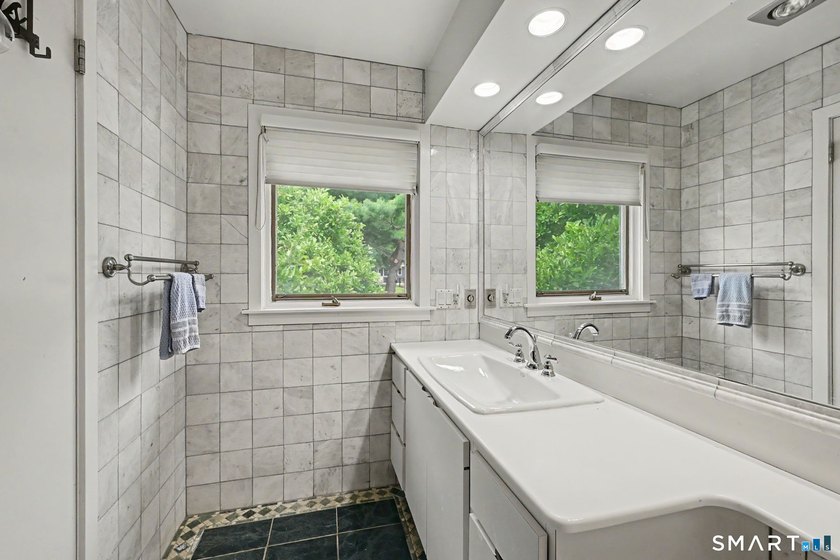 Tucked away on a quiet, tree-lined street in North Stamford - photo 20