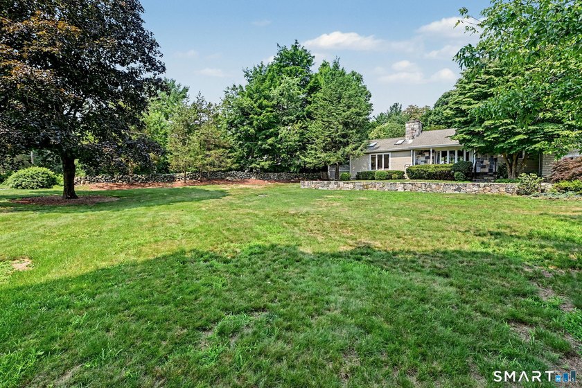 Tucked away on a quiet, tree-lined street in North Stamford - photo 32
