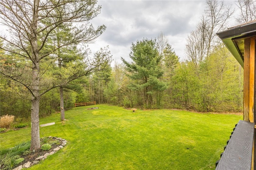 Tucked away on a peaceful private road, this heavenly log home - photo 39