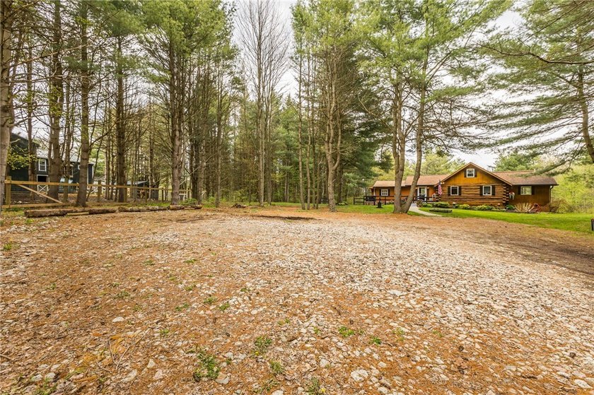 Tucked away on a peaceful private road, this heavenly log home - photo 42