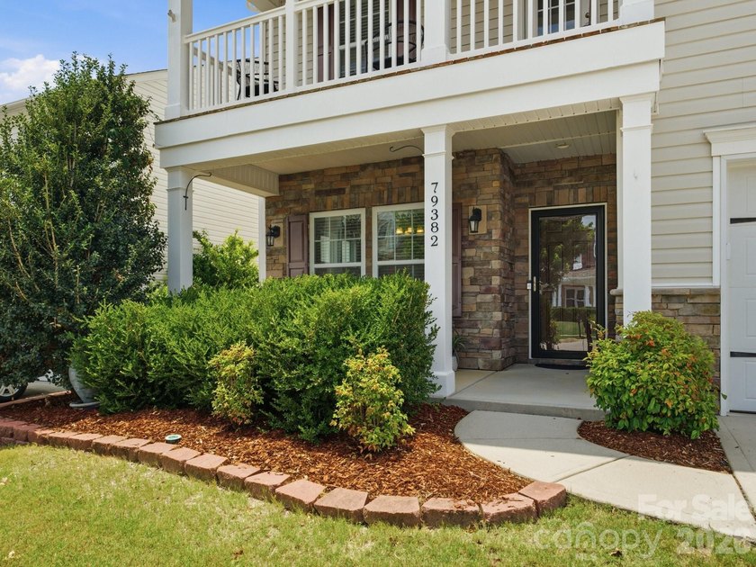 Welcome home to this beautifully appointed home in the highly - photo 2