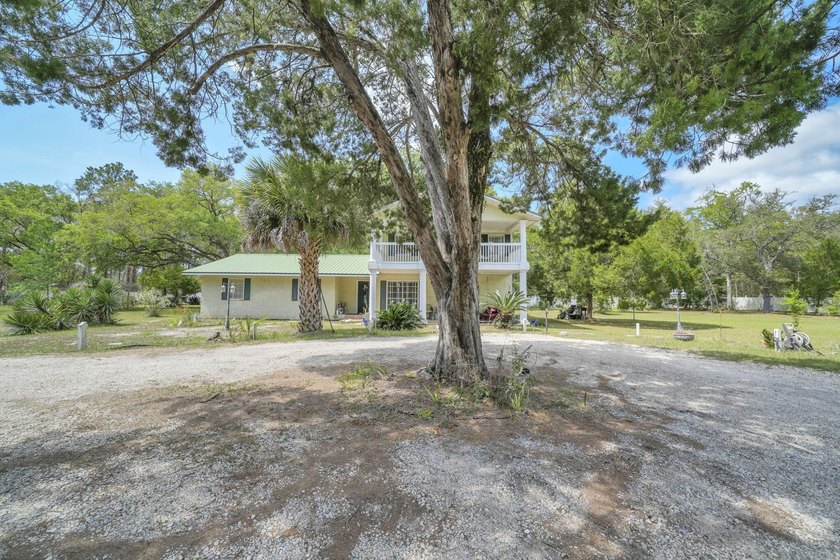 Set on 4.63 cleared acres along a paved county road, this unique - photo 4