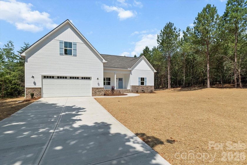 New Construction ranch home on large lot with bonus room above - photo 6