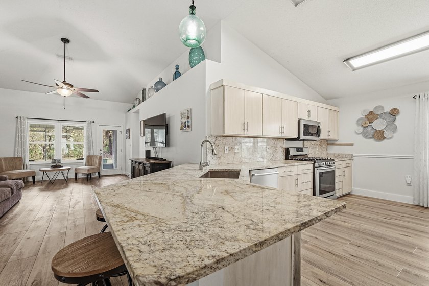 Welcome to 475 Sandy Cay Drive--an exceptional 4-bedroom, 2-bath - photo 5