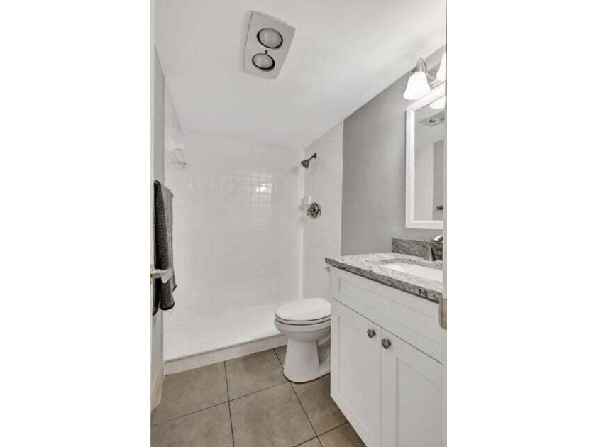Beautifully remodeled ground floor unit in a gated 55 + - photo 12