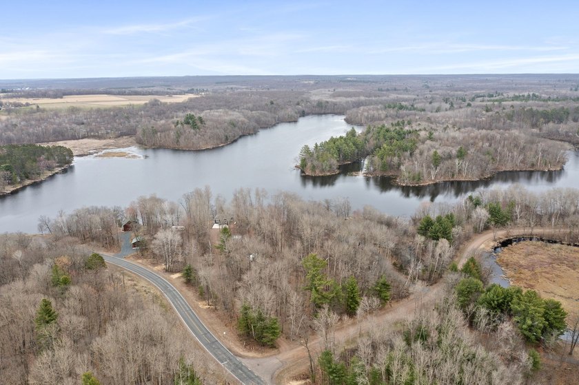 Experience a premier 2.9-acre wooded waterfront lot on Clam - photo 5