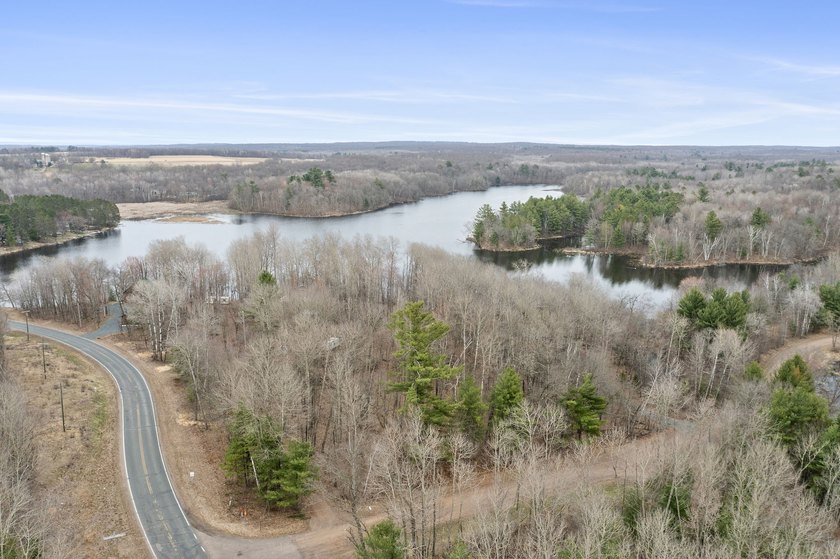 Experience a premier 2.9-acre wooded waterfront lot on Clam - photo 6