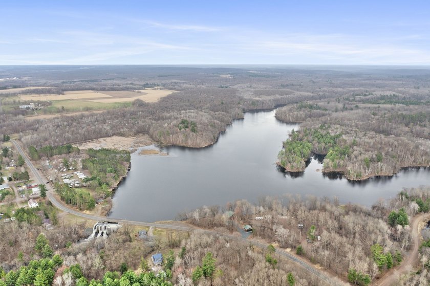 Experience a premier 2.9-acre wooded waterfront lot on Clam - photo 7
