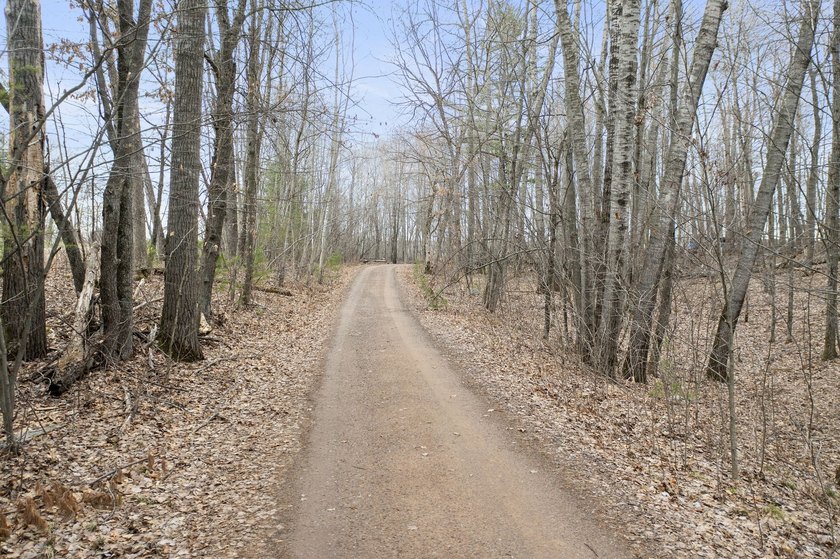 Experience a premier 2.9-acre wooded waterfront lot on Clam - photo 9