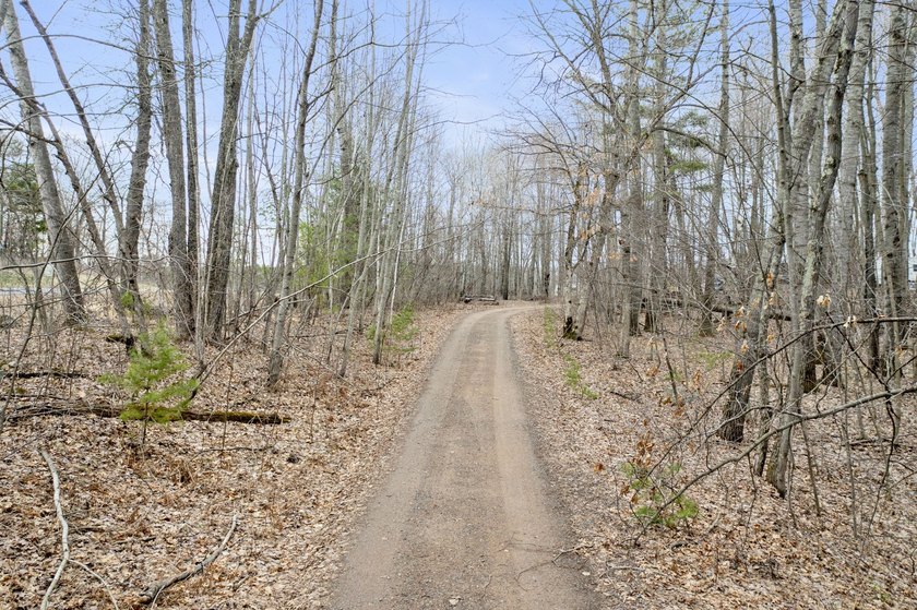 Experience a premier 2.9-acre wooded waterfront lot on Clam - photo 10