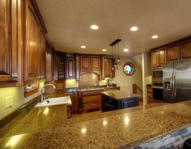Welcome to Grand View Falls, where this custom-built residence - photo 13