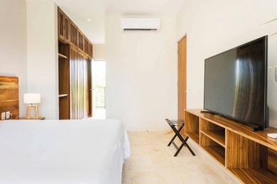 Located within the vibrant Zama Village in Tulum, Penthouse 206