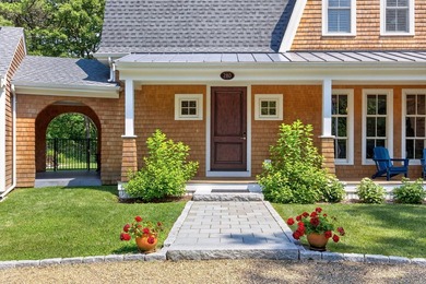 Set on an oversized 2.94-acre corner parcel within Osterville's - photo 9