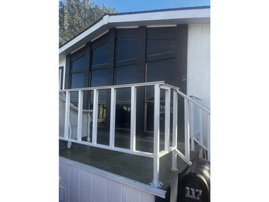 Ready to move in? This 2-bedroom 2-bath mobile home is waiting - photo 1