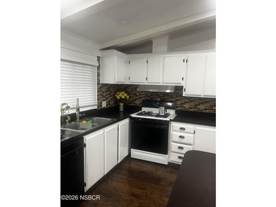 Ready to move in? This 2-bedroom 2-bath mobile home is waiting - photo 5