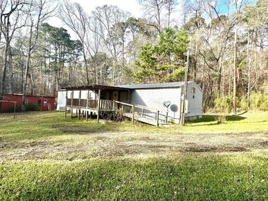 Situated on approximately 0.9 acres, this 1985 18x80 single-wide - photo 3