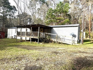 Situated on approximately 0.9 acres, this 1985 18x80 single-wide - photo 4