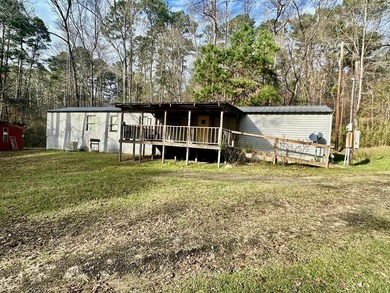 Situated on approximately 0.9 acres, this 1985 18x80 single-wide - photo 5