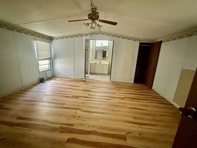 Situated on approximately 0.9 acres, this 1985 18x80 single-wide - photo 8