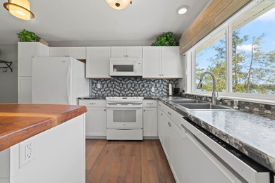 PRICE JUST REDUCED of this CHARMING LAKEFRONT RETREAT ON - photo 13