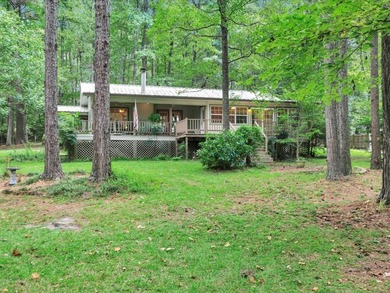 Waterfront Retreat on Lake Pinkston! Nestled on 1.21 acres with
