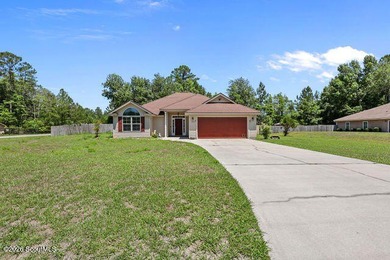 A welcoming three-bedroom, two-bath vinyl-sided home combines - photo 2
