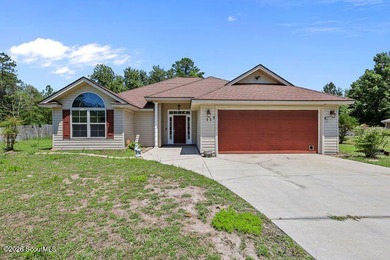A welcoming three-bedroom, two-bath vinyl-sided home combines - photo 5