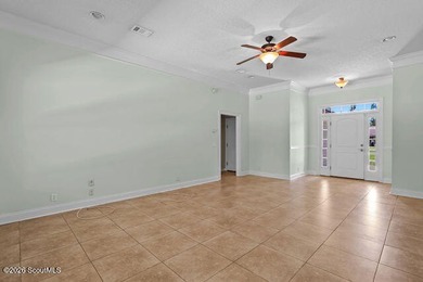 A welcoming three-bedroom, two-bath vinyl-sided home combines - photo 9