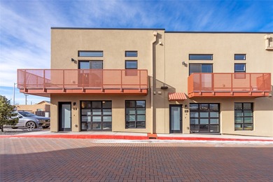 Corner unit with a wraparound balcony and mountain views in