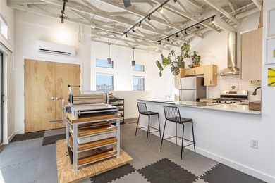 Corner unit with a wraparound balcony and mountain views in