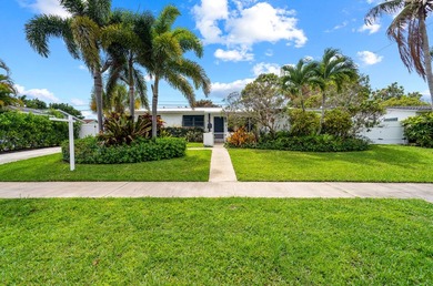 Beautifully updated 4/2 pool home in North Palm Beach. New metal - photo 1