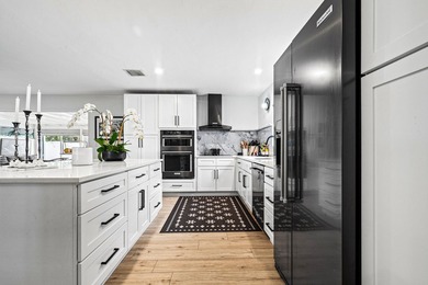 Beautifully updated 4/2 pool home in North Palm Beach. New metal - photo 6