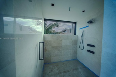 Set on a coveted point lot in the exclusive Harbor Beach enclave