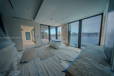 Set on a coveted point lot in the exclusive Harbor Beach enclave