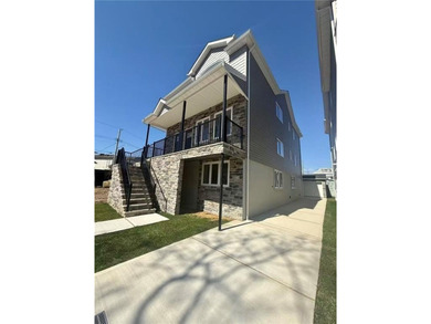 This exceptional new construction two-family home offers the - photo 3