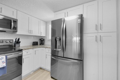 Beautifully remodeled, HIGH INCOME, direct ocean front condo at - photo 13