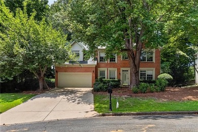 Welcome home to this beautifully maintained brick-front - photo 1