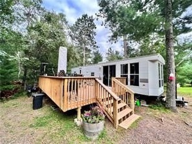 Introducing a charming property nestled on the serene shores of - photo 1