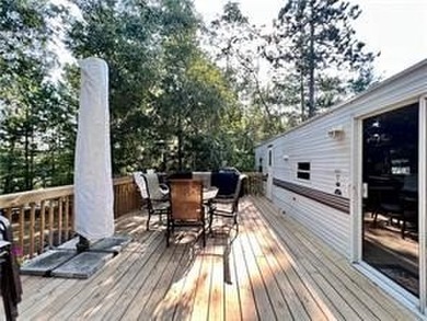 Introducing a charming property nestled on the serene shores of - photo 4