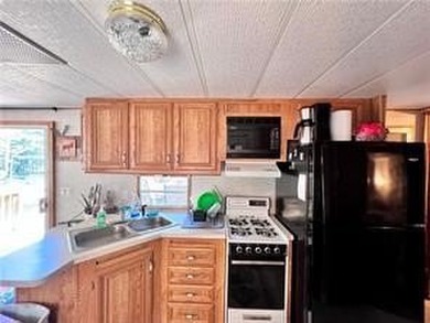 Introducing a charming property nestled on the serene shores of - photo 6