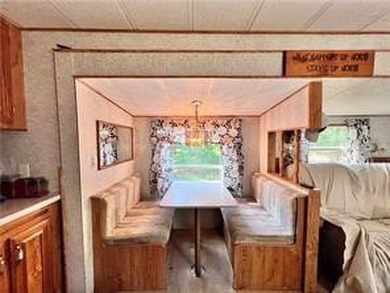 Introducing a charming property nestled on the serene shores of - photo 7