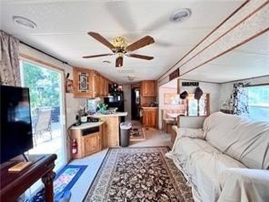 Introducing a charming property nestled on the serene shores of - photo 8