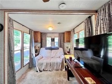Introducing a charming property nestled on the serene shores of - photo 9
