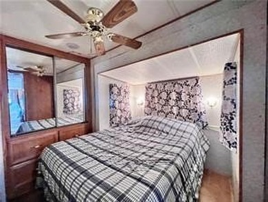 Introducing a charming property nestled on the serene shores of - photo 10