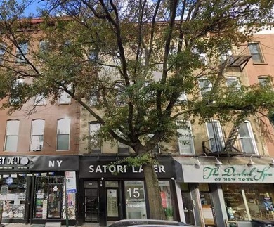 Well-maintained 3-family property featuring a one-store - photo 1